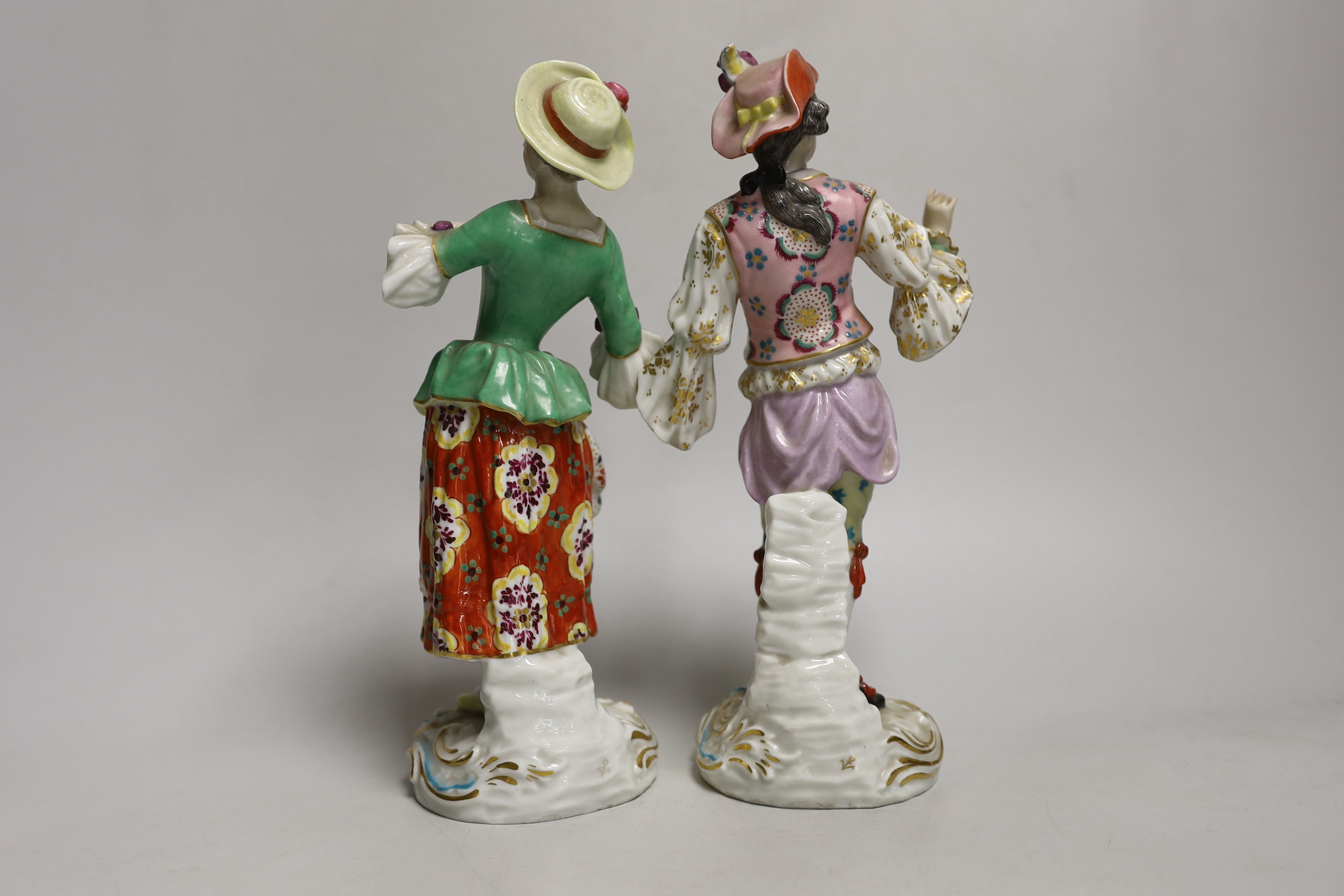 A pair of Continental porcelain figures, 23cm high